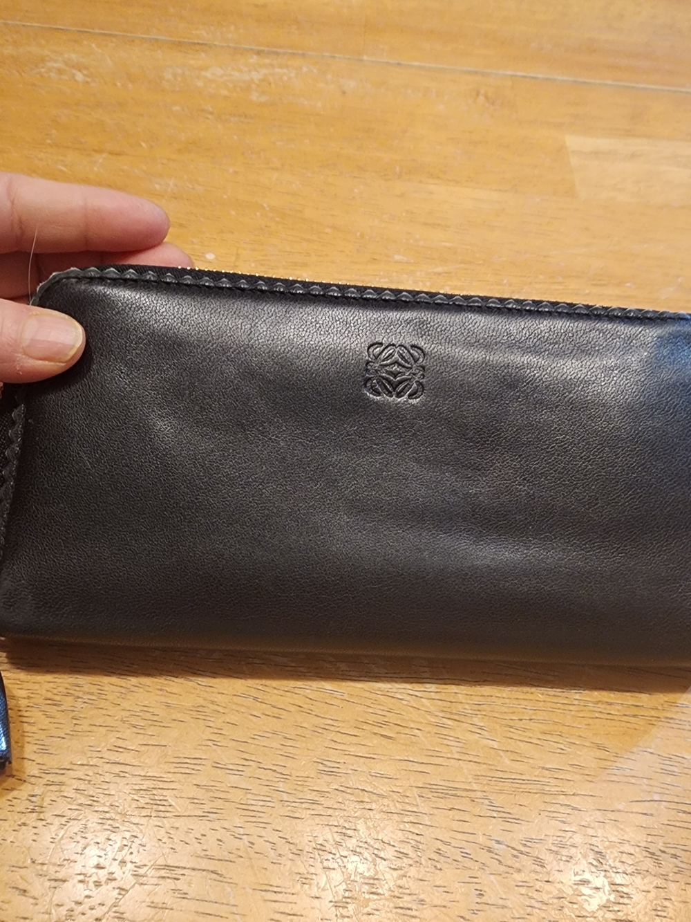 Loewe zip-around wallet featuring the anagram logo black leather tassel pull